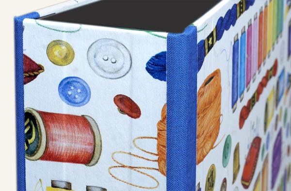 Colorful folder with needle and thread motif